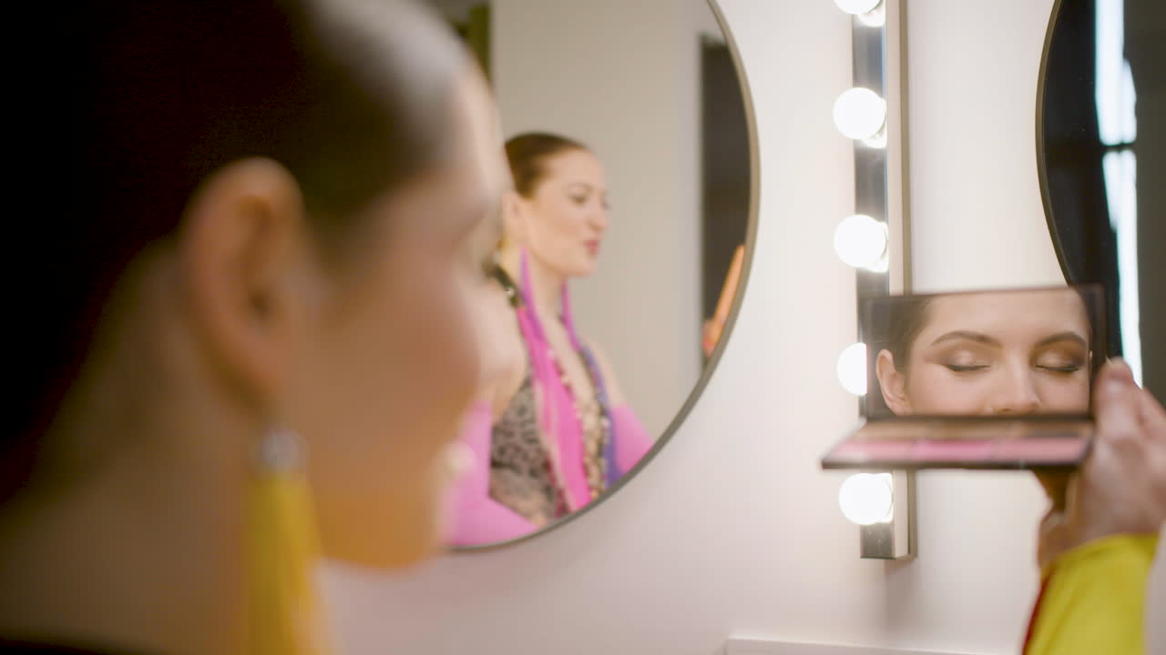 A Showing Looking At Herself In The Mirror