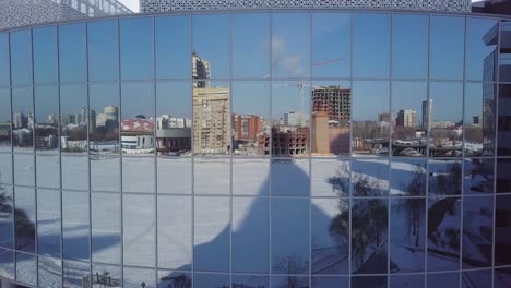 winter cityscape reflected in modern building windows