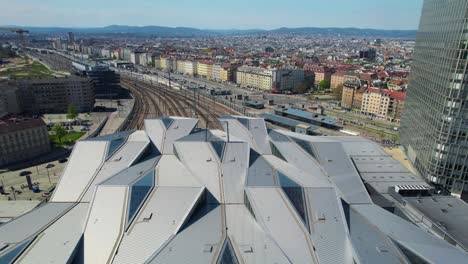 vienna-skyline-from-train-station,-railroads,-Wien-hauptbahnhof,-flying-drone-shot