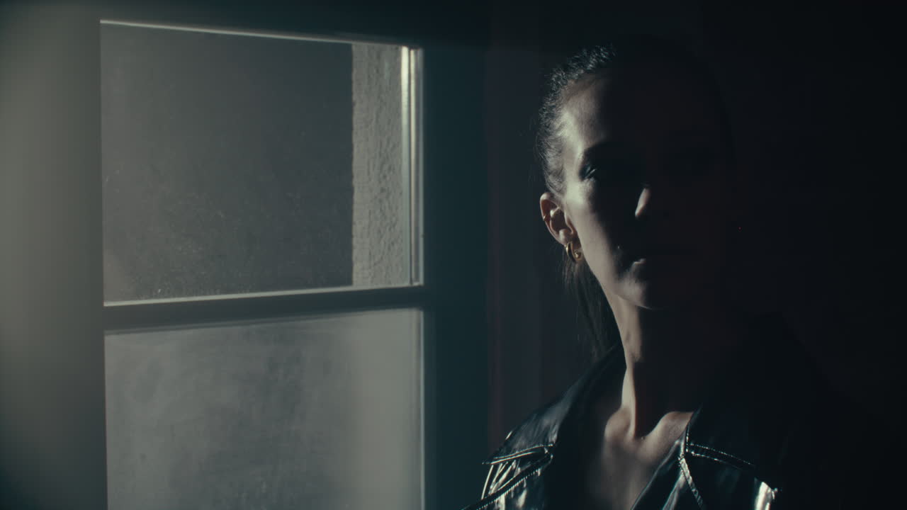 Woman at Window at Night