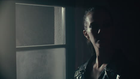 woman at window at night