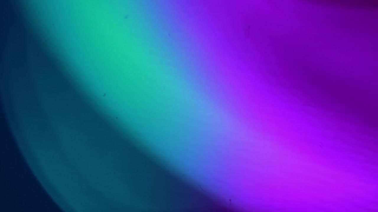 Abstract Background with Soft Purple and Teal Light Leaks