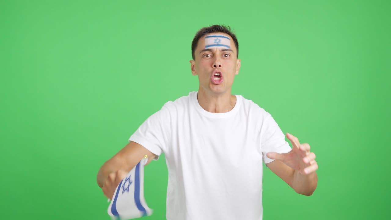 Man cheering for Israel screaming and waving a national flag