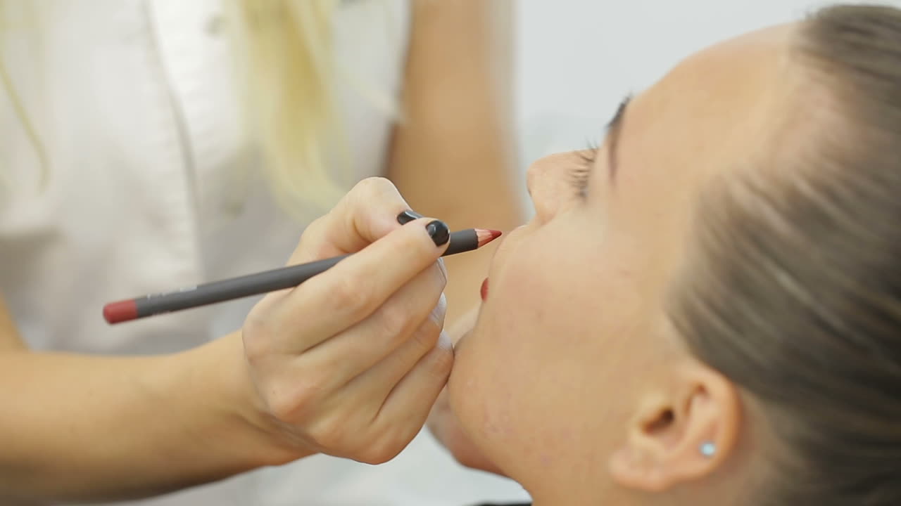 Permanent Make-up on her Lips. Portrait of lovely young woman getting permanent makeup on her lips