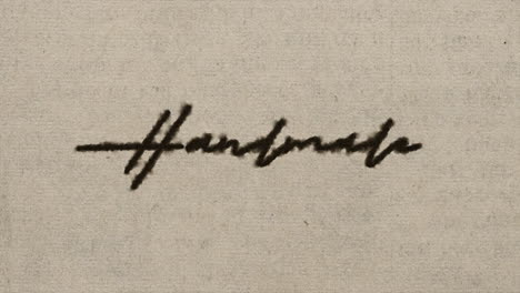 Script font graphic with ink bleeding into paper and on green screen, writing the text &amp;quot;handmade&amp;quot;, in 4k at 60fps