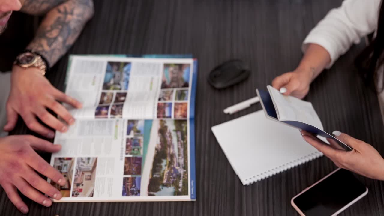 Top view closeup, couple hands passports for paperwork for travel