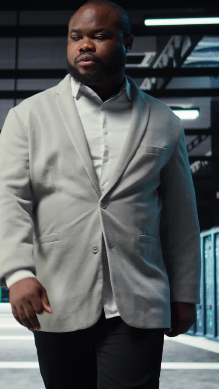 Vertical video Admin working in high tech server hub