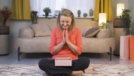 happy and joyful woman opening gift package.