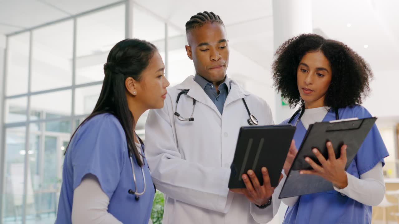 Healthcare, tablet and a doctor talking to nurses