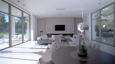 indoor view of the living room with dining table in a french modern mansion