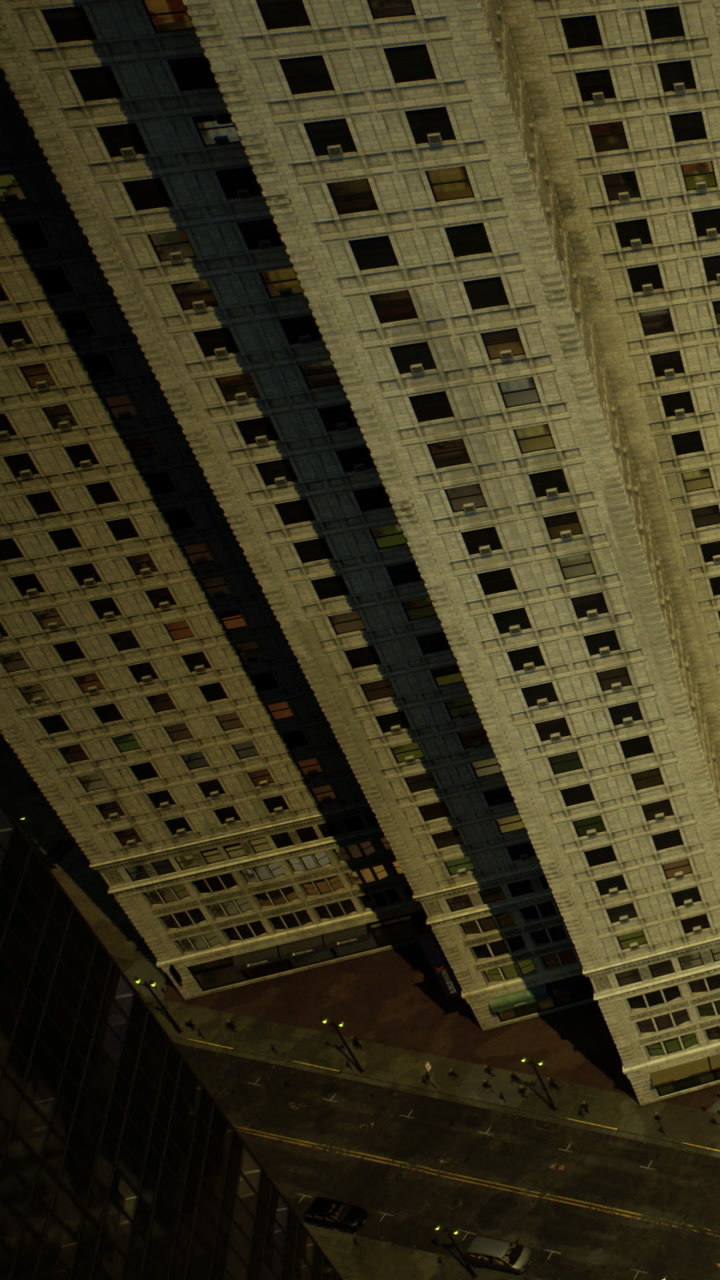 Tall building viewed from above in a busy city during the day with many details