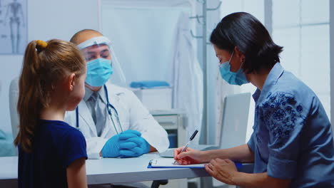 Woman-writing-prescription-on-clipboard