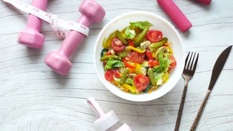 healthy salad with fitness accessories