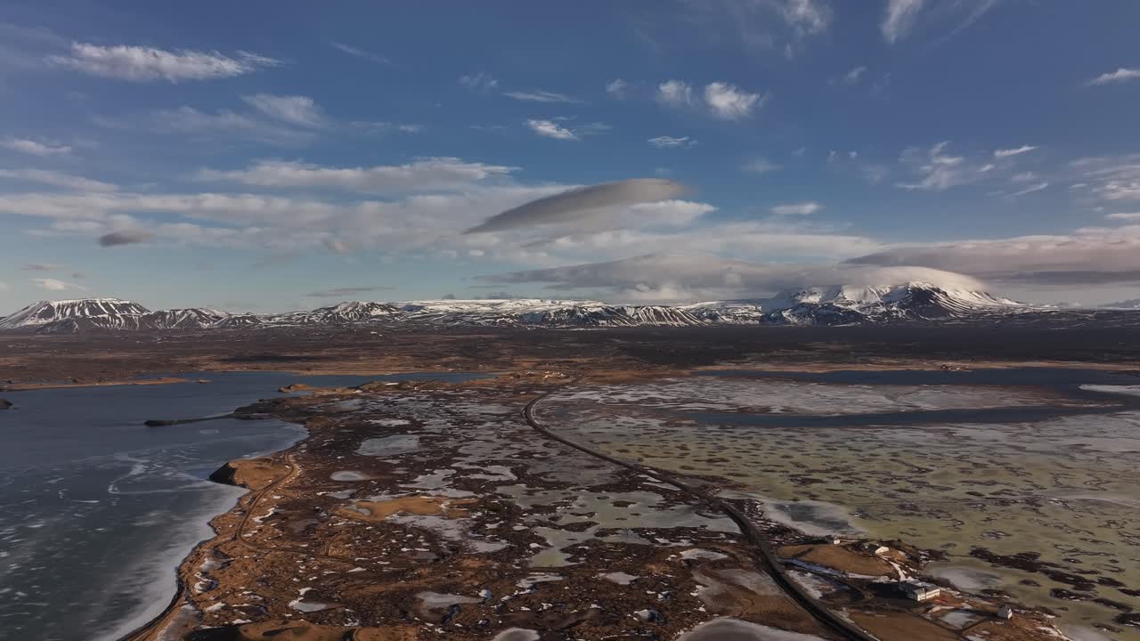 Stunning aerial panorama of Reykjahlíð and Lake Mývatn, Iceland, with volcanic terrain.