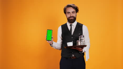 Bearded-waiter-presents-greenscreen