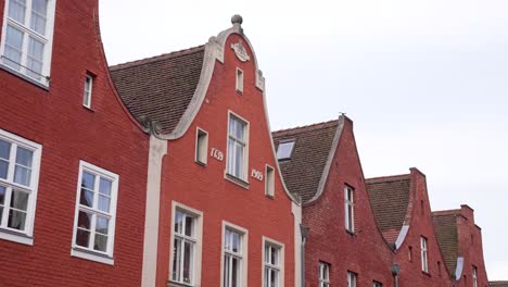 traditional roofs of red brick houses in historical district