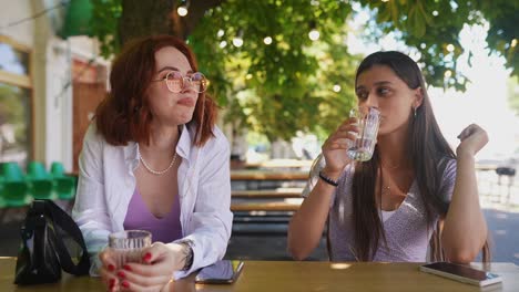 two women friends enjoying a cafe conversation