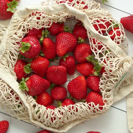 Fresh-strawberries-in-eco-friendly-package-on-white-wooden-background--Vegetarian-organic-meal