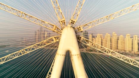 aerial view passing by of the ferris wheel under construction, dubai.