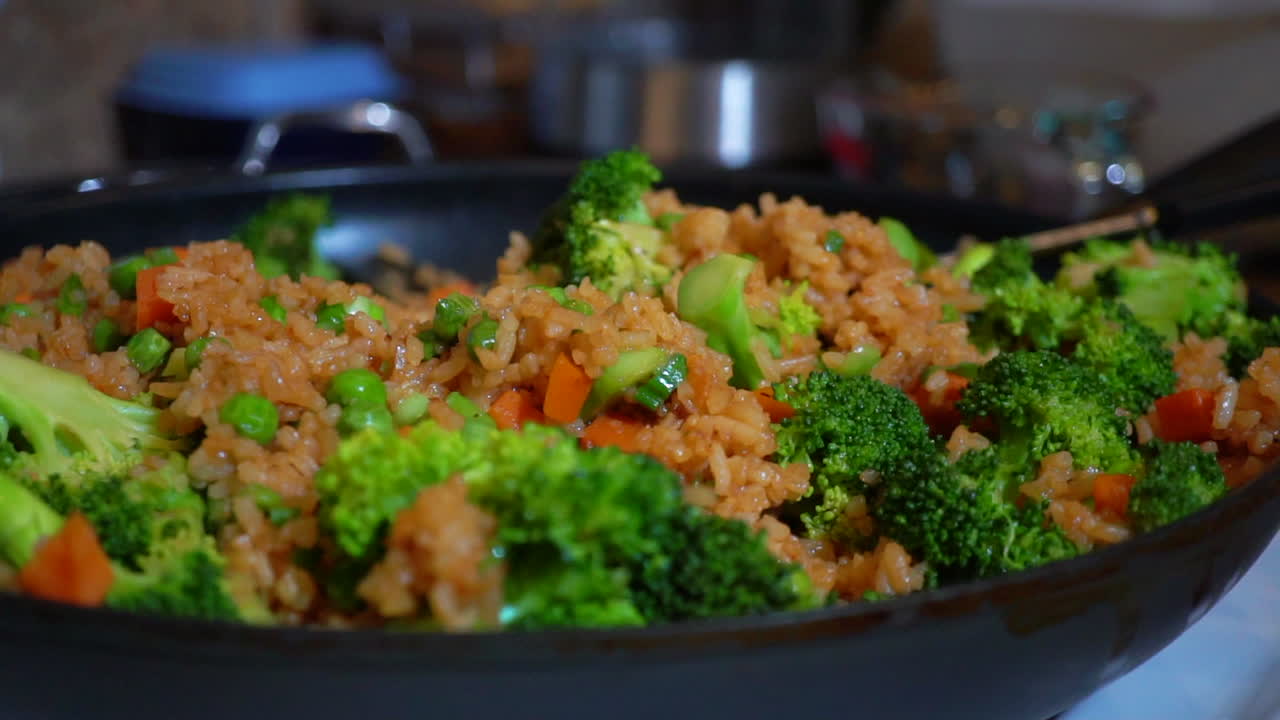 Closeup Detail of Vegetable Stir Fried Rice with Broccoli in Skillet