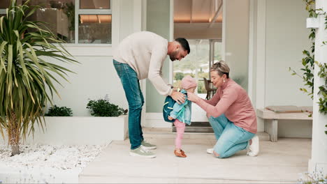 Mom,-dad-and-kid-with-backpack-for-kindergarten