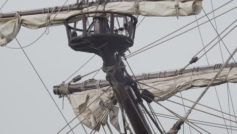 galleon andalucia replica ship detail tilt shot of forecastle mast and sail while docked in valencia in slow motion 60fps