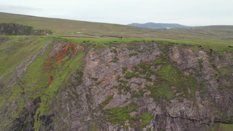 Carrowteige-Cliffs-in-perspective-with-two-people-standing-on-top