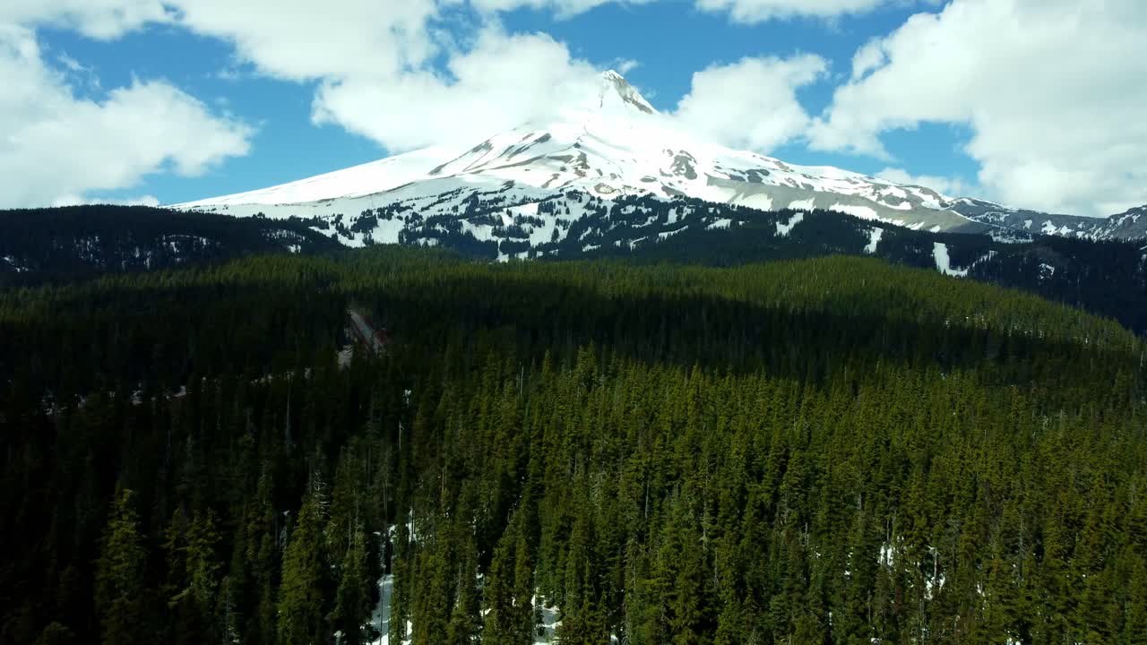 US, Oregon, Mt Hood, Bennett Pass, 2025-04-22 - Drone view of Mt Hood outside of Portland. On a spring day, with some clouds, viewed from the Southeast at Mt Hood Meadows