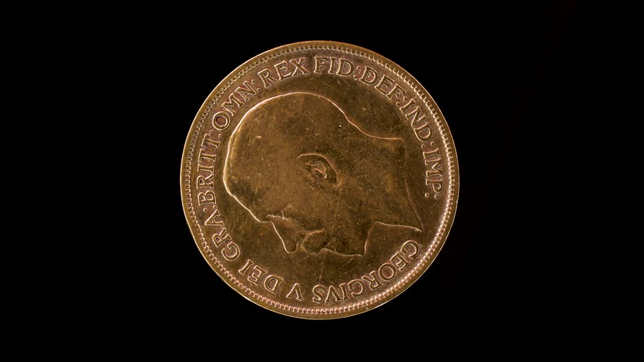 United Kingdom 1920 one penny coin obverse with George V portrait rotating on black background