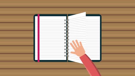 hand flips a page reading a notebook with bookmark