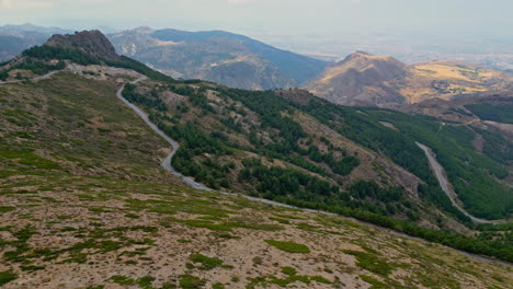 Aerial-drone-shot-of-a-highway-between-the-mountains-of-Andalusia-Spain