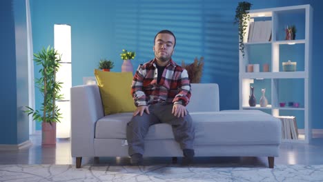 Unhappy-and-lonely-disabled-dwarf-young-man-depressed-and-thoughtful-at-home.