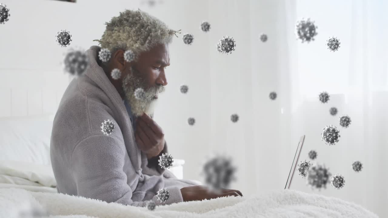 animación de células de virus sobre un hombre afroamericano usando una computadora portátil