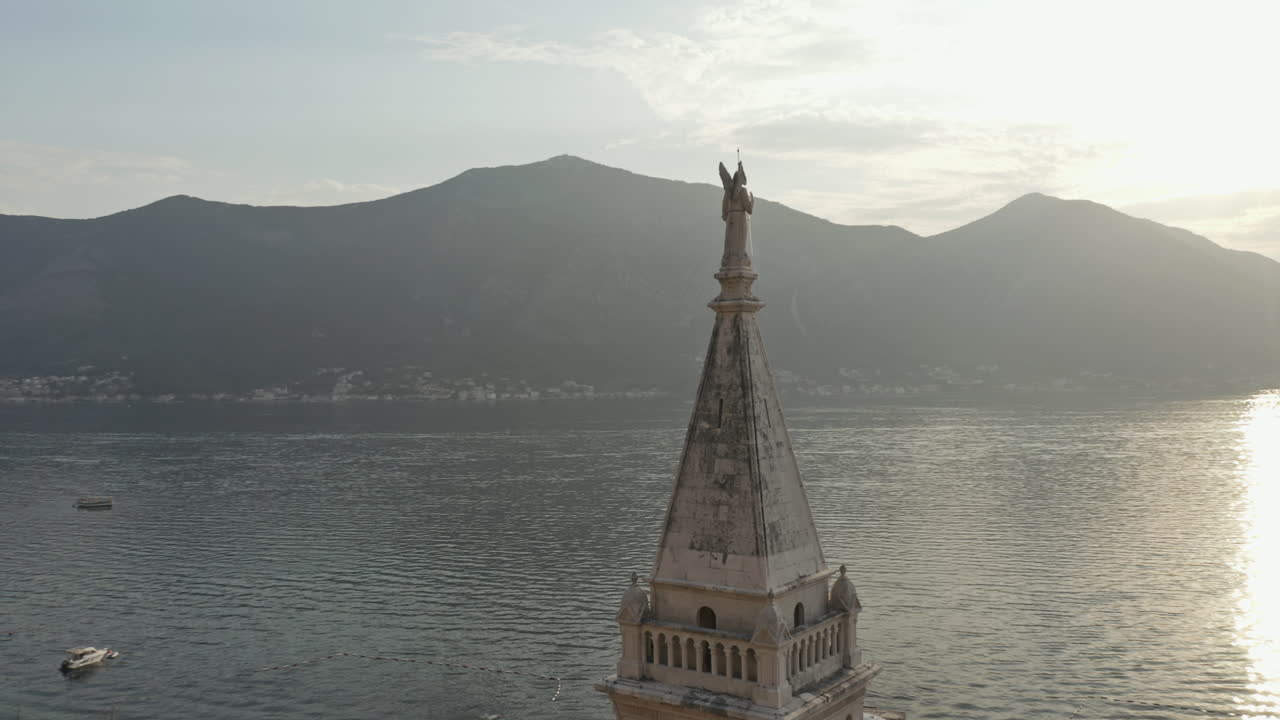 Aerial rotation shot around a Church Steeple in Kotor, Montenegro