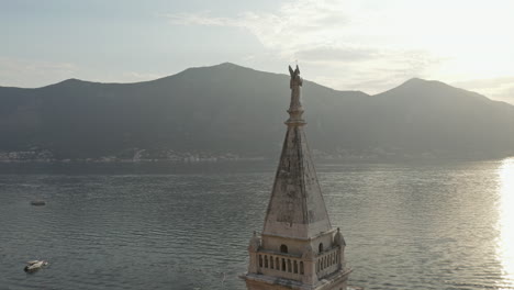 aerial rotation shot around a church steeple in kotor, montenegro