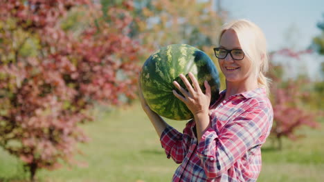 woman holding a watermelon