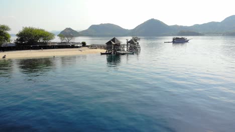 Sandy-beach-and-jetty-on-the-Island-Of-Kelor-On-Sunny-Summer-Day