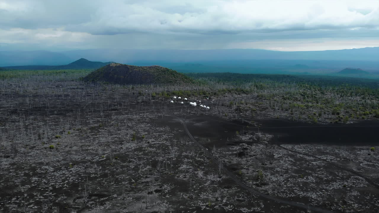 Volcanic Landscape with Dome Tents