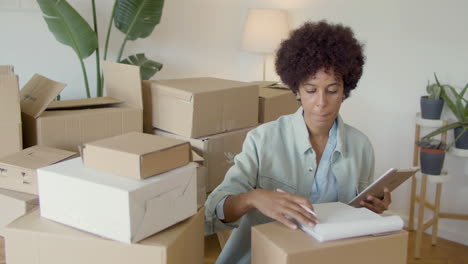 focused female entrepreneur checking stock inventory