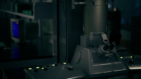 technological apparatus in a dimly lit research facility during evening hours