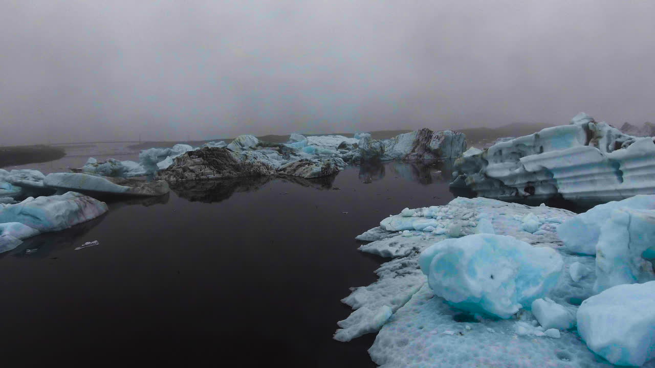 Drone aerial view of Icebergs in Jokulsarlon glacial lagoon in Iceland.