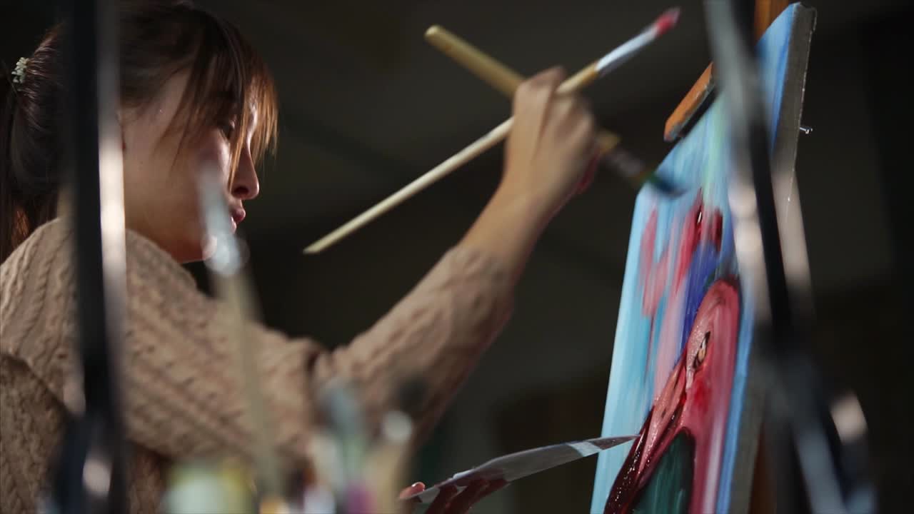 Woman Painting a Colorful Abstract Picture in an Art Studio