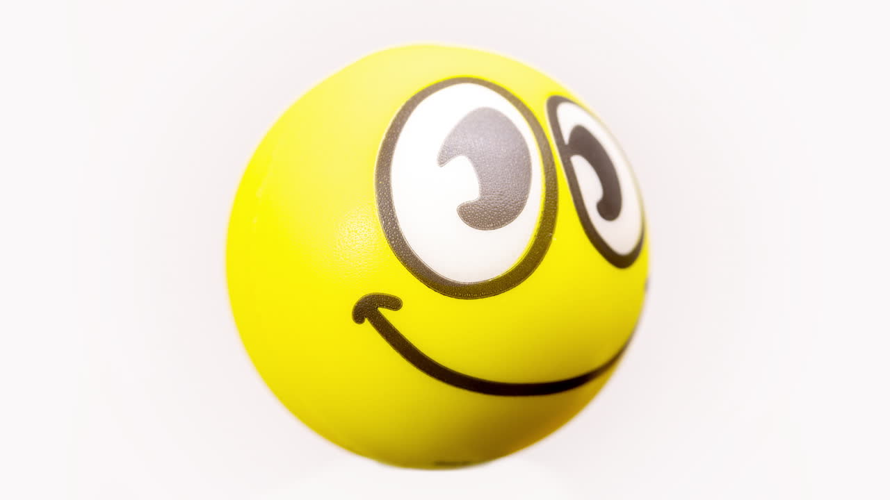 emoji con cara sonriente girando