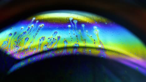 4k stable shots of soap balloons showing the colors of the macro world through a microscope perspective