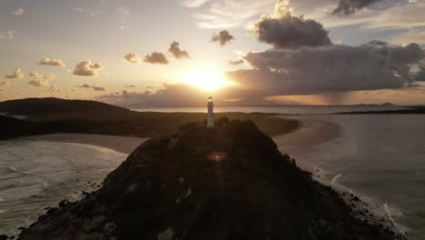 Aerial-view-of-the-Farol-das-Conchas-lighthouse-and-beaches-of-Ilha-do-Mel-at-sunset,-Paranaguá,-Paraná,-South,-Brazil