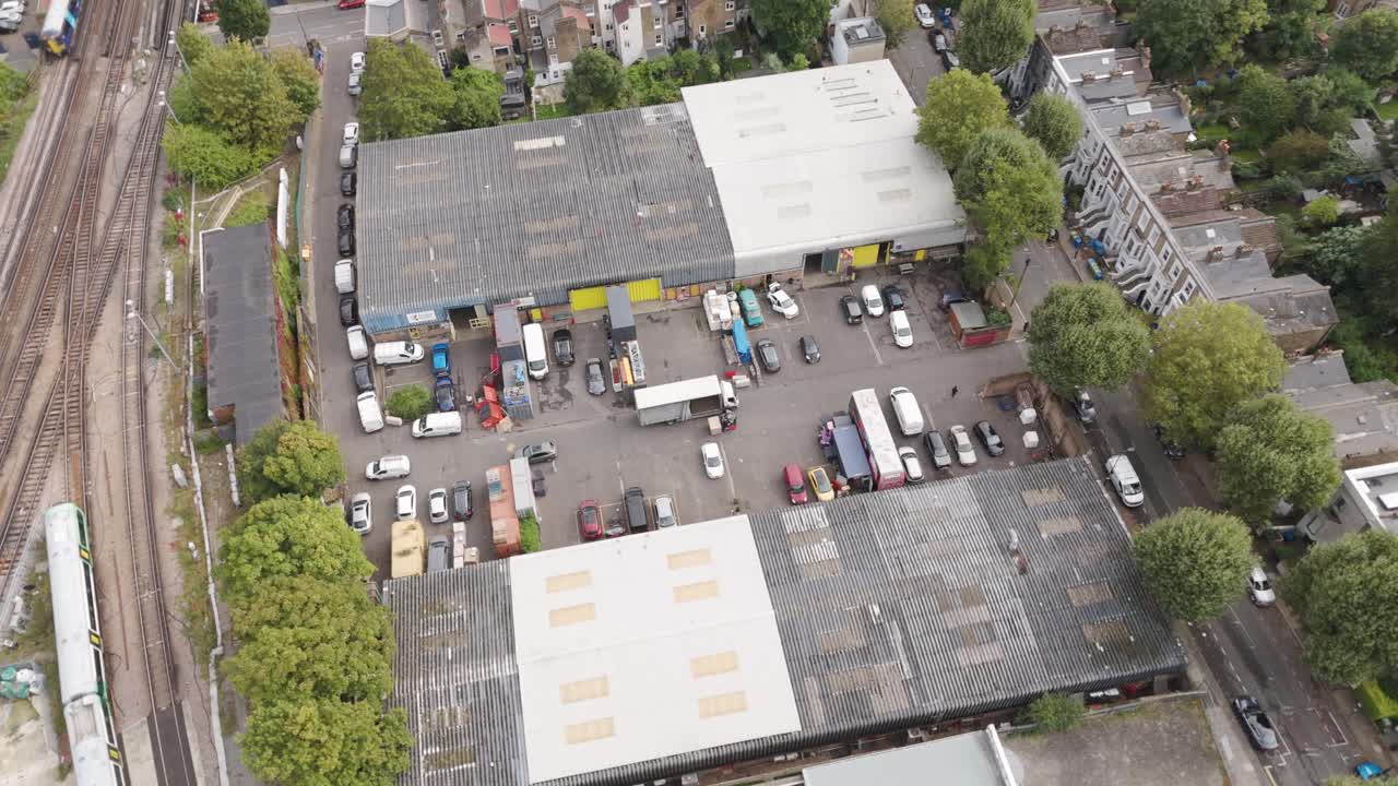 Aerial view of a small industrial estate in Peckham Rye with visible warehouses, London, UK, October 2024