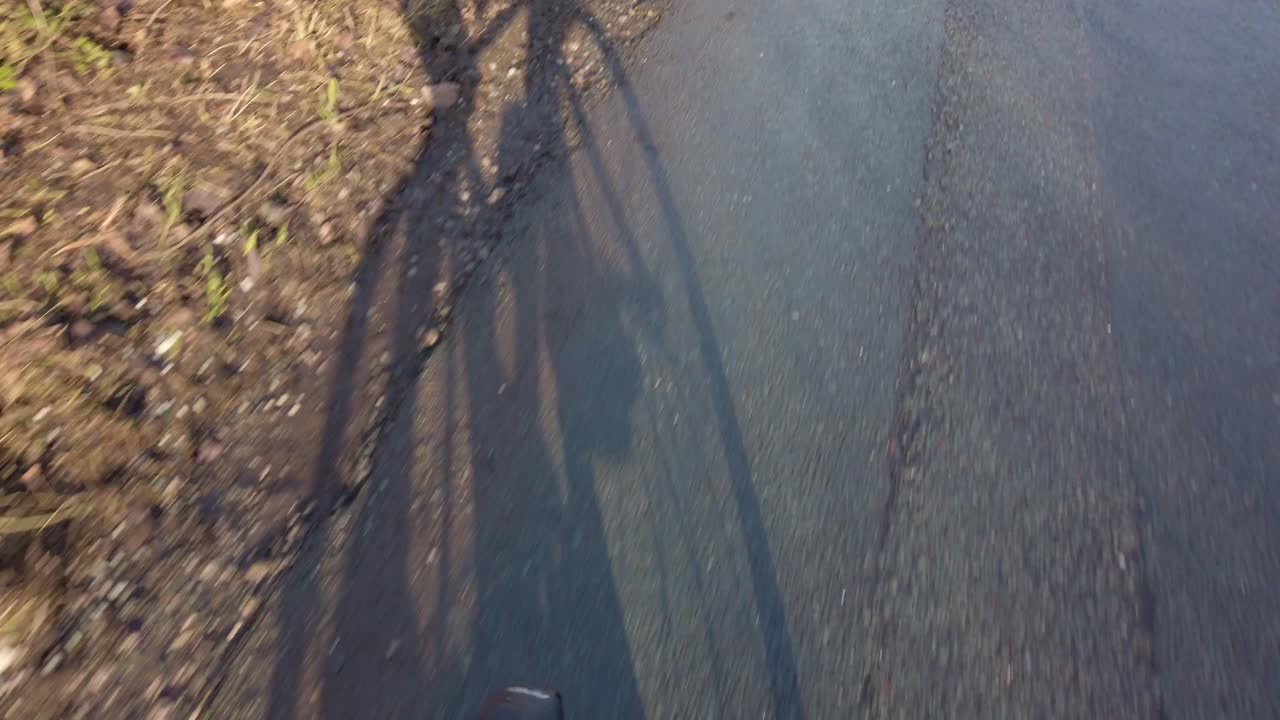 POV shot road bike ride cycling on poor condition roads pot holes