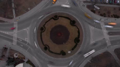 4k aerial view timelapse of roundabout road with circular cars.