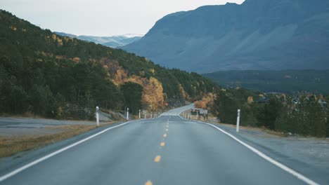 narrow two-lane road snaking along the fjord-1