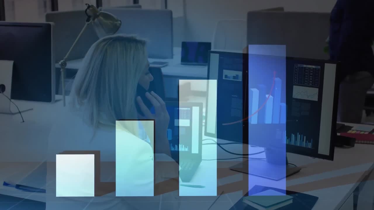 Animation of graph over caucasian businesswoman using phone and computer in office